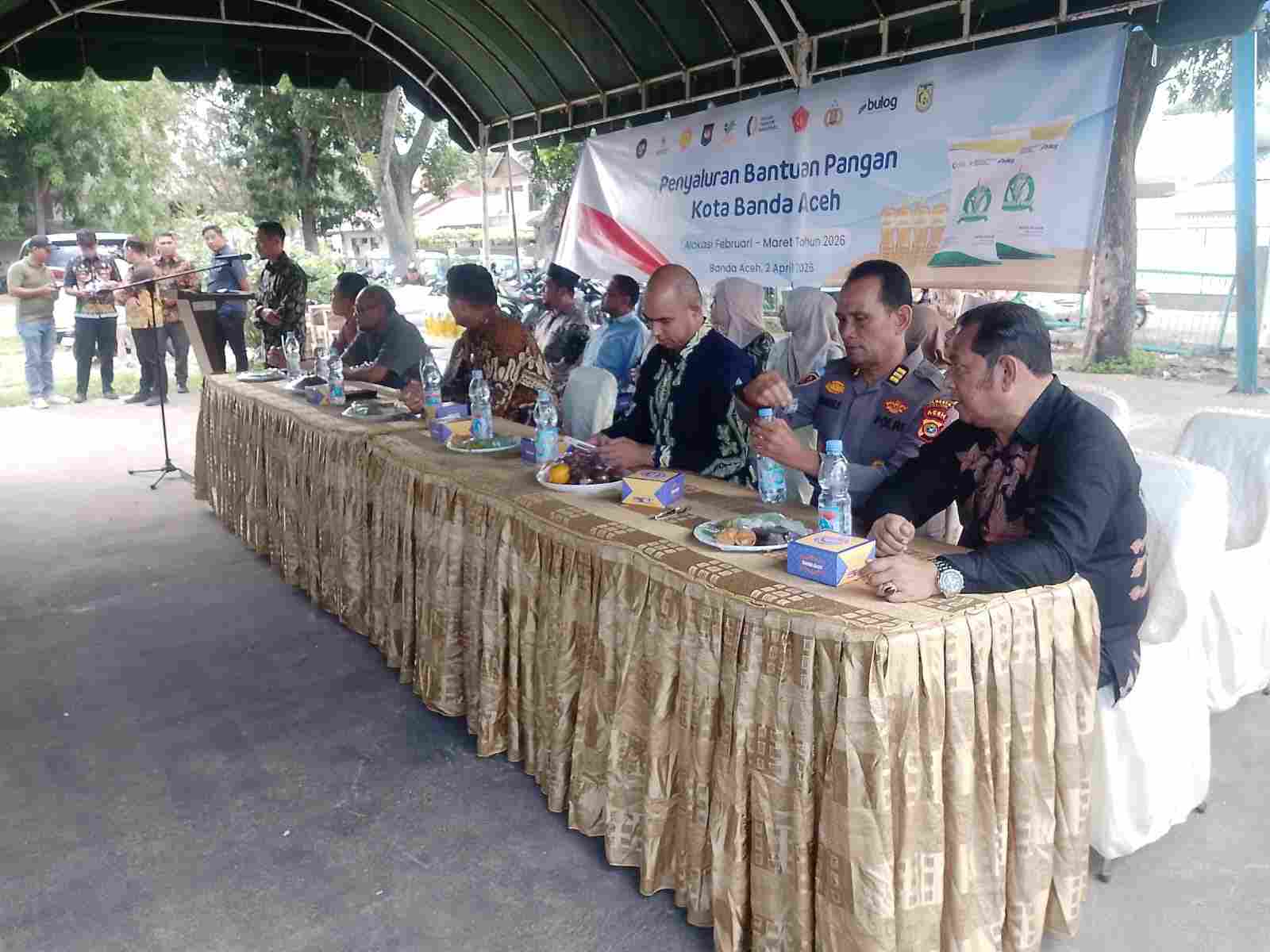 Kabag Logistik Polresta Hadiri Kegiatan Pembagian Beras Untuk Warga